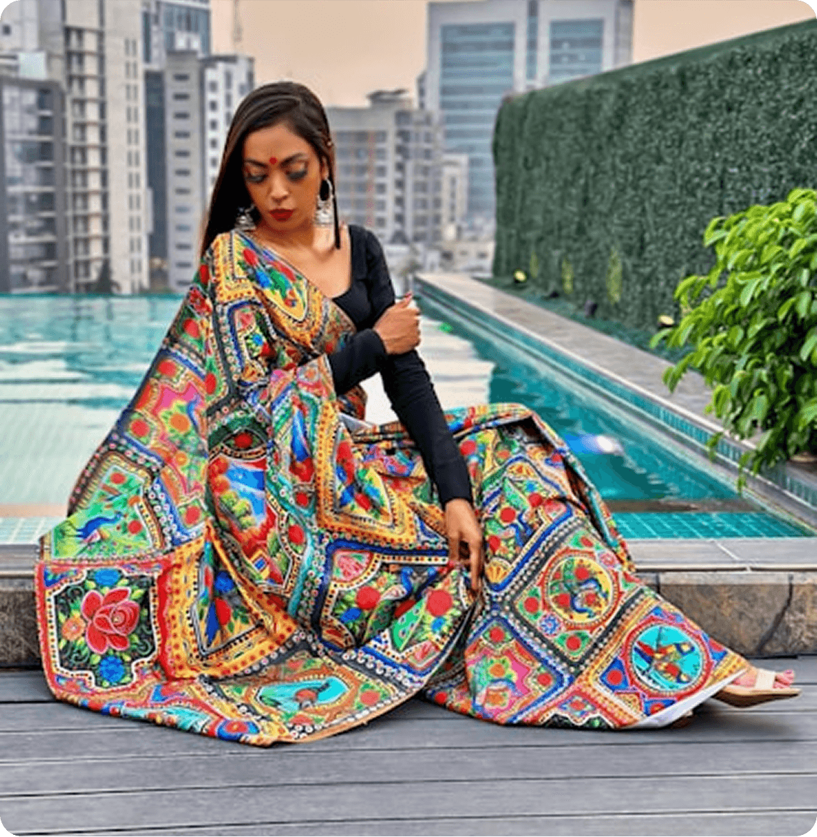 A model wearing a vibrant green traditional outfit.