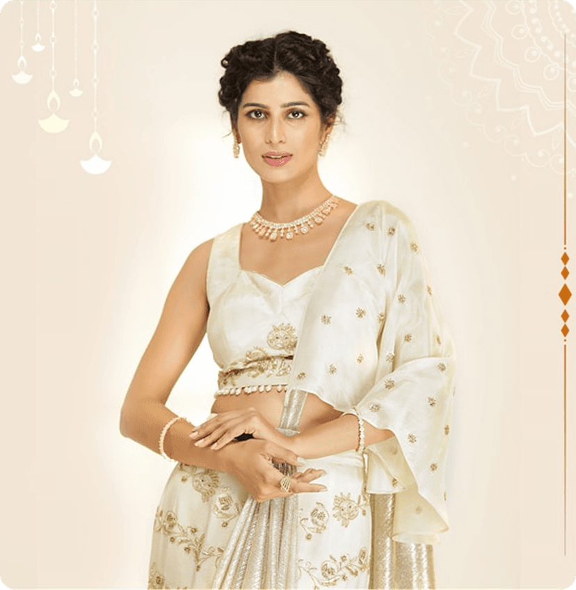 A model wearing a new arrival white saree.